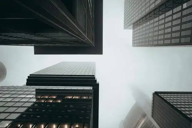 Skyscrapers pointing to the foggy sky